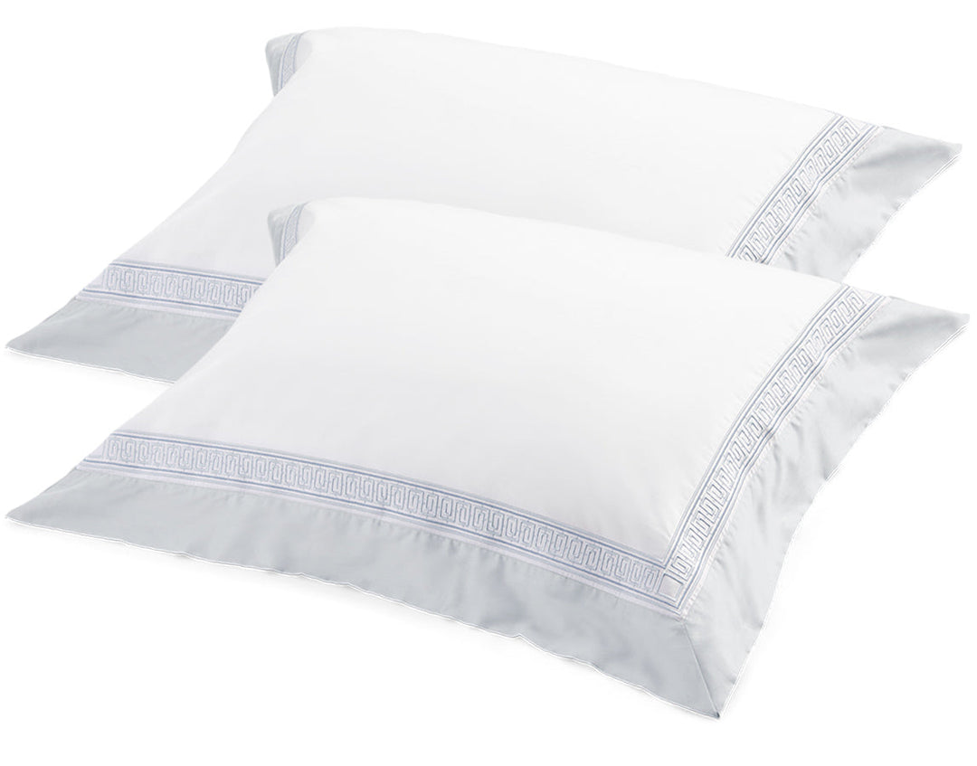 Rhodes tailored pillowcases with blue embroidered border