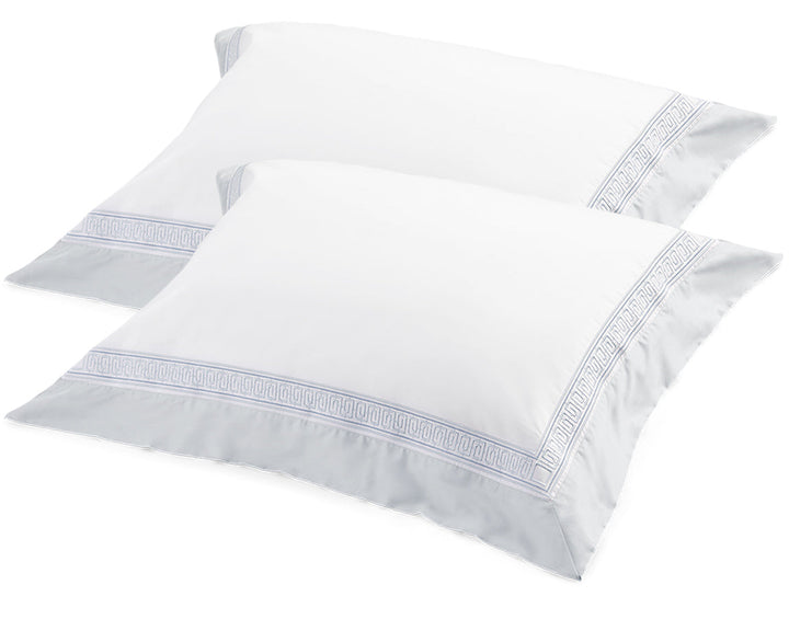 Rhodes tailored pillowcases with blue embroidered border
