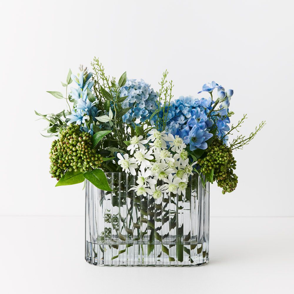 Wide artificial blue and white hydrangea and delphinium in ripple glass vase 45cm