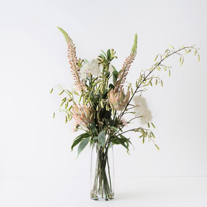 Artificial dandelion and protea arrangement in glass vase 110cm