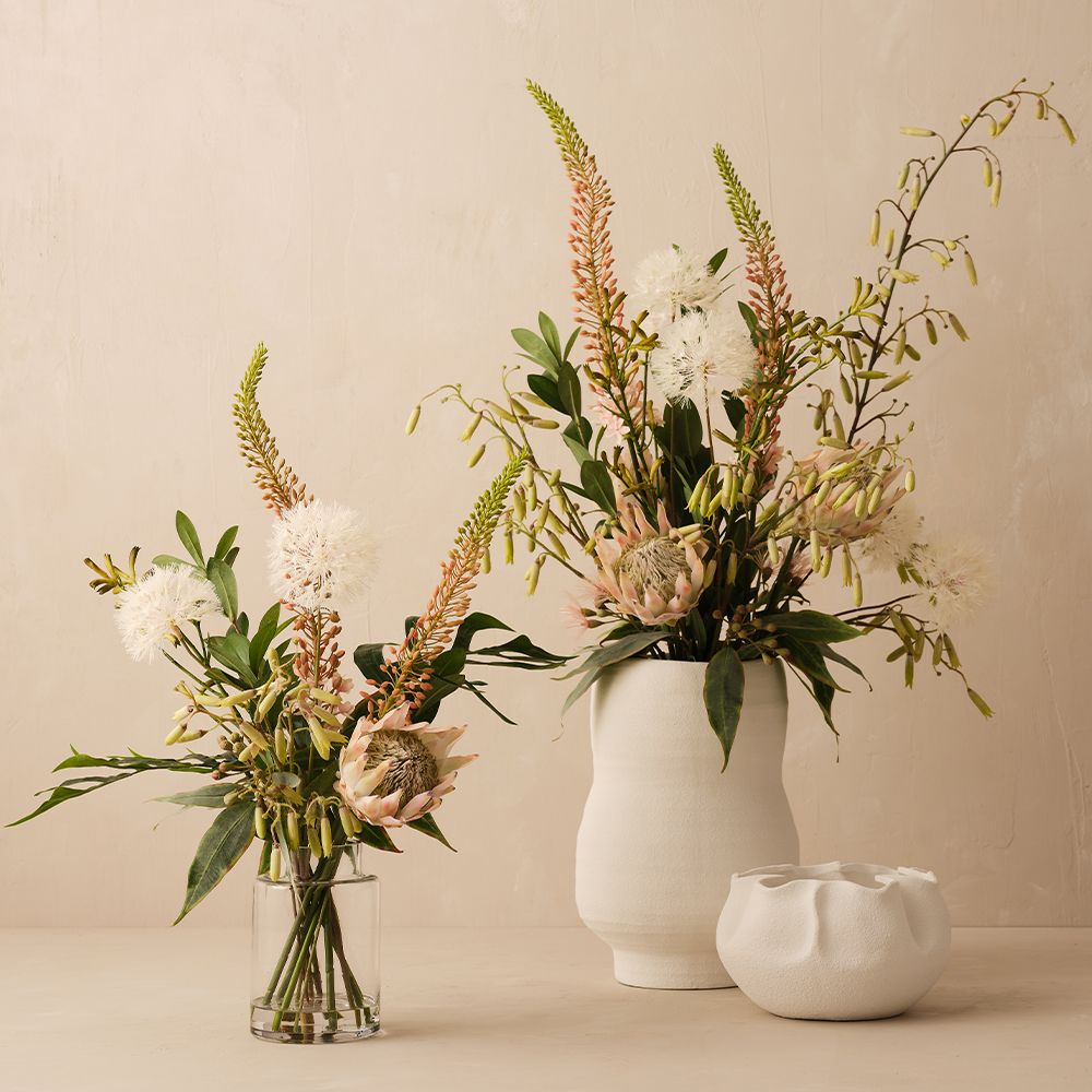 Artificial dandelion and protea arrangement in glass vase 110cm – view 3