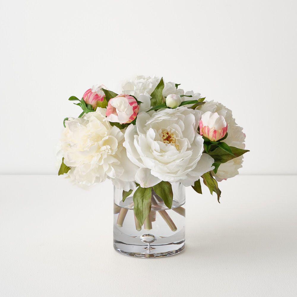 Artificial white peonies in glass vase 25cm