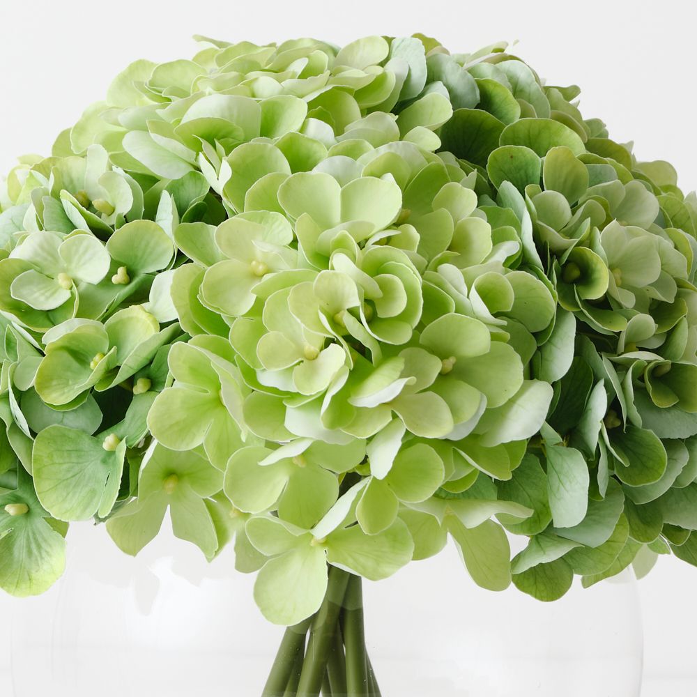 Artificial light green hydrangeas in large round glass vase – view 2