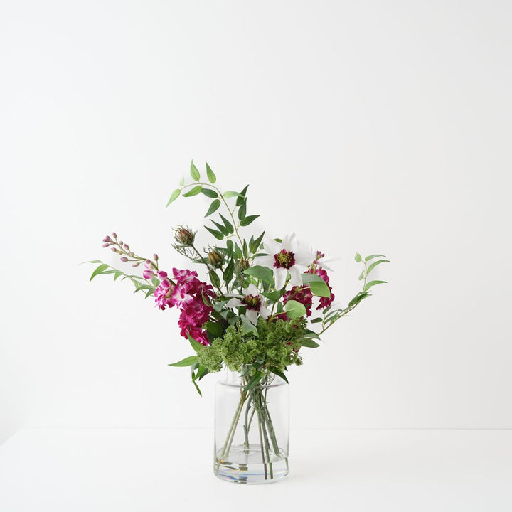 Artificial white clematis and fuchsia stock arrangement in glass vase 48cm